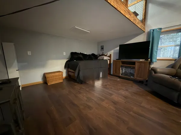 a living room with furniture and a chandelier