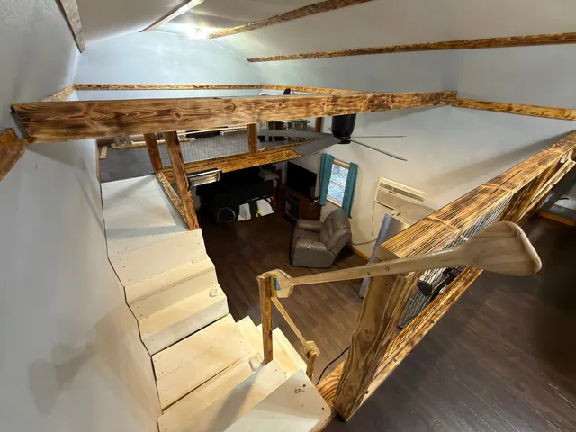 a view of a livingroom with furniture and window