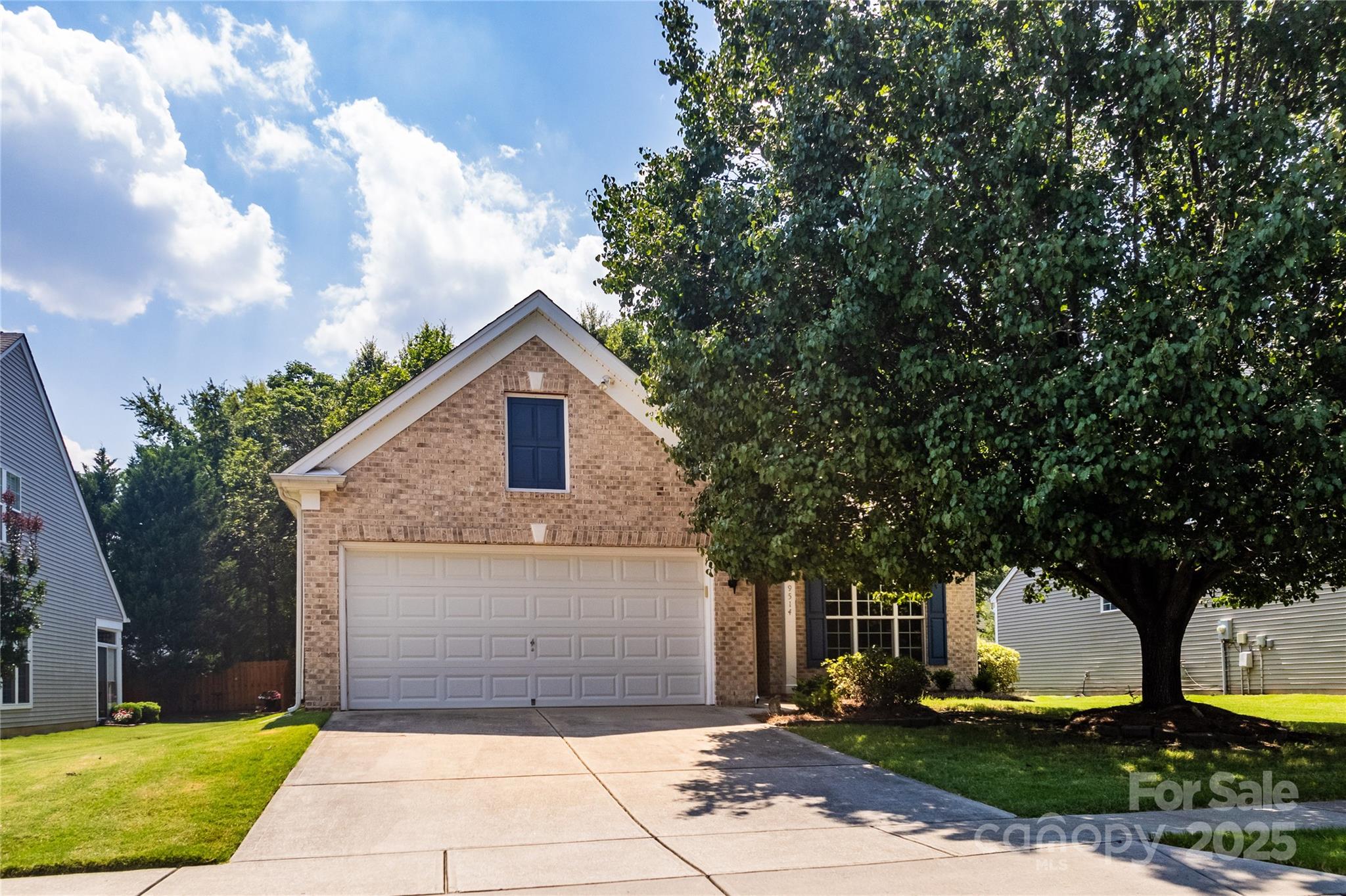 9514 Kestral Ridge Drive Charlotte, NC 28269 - Photo 1 of 32 a front view of house with yard