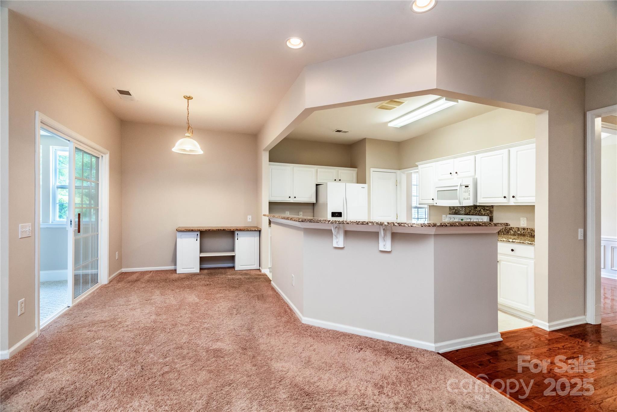 9514 Kestral Ridge Drive Charlotte, NC 28269 - Photo 15 of 32 a view of kitchen with stainless steel appliances granite countertop refrigerator and stove top oven