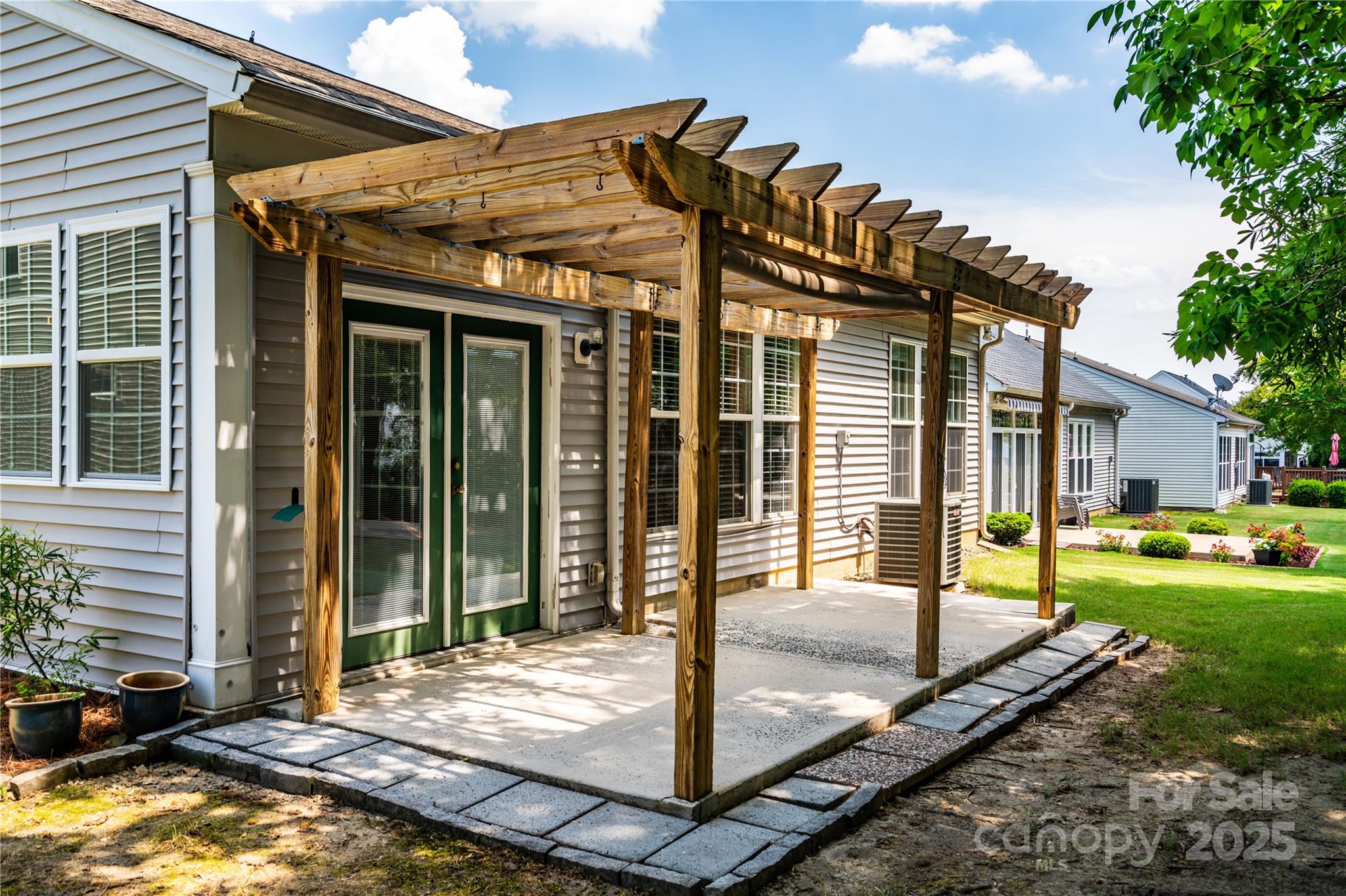 9514 Kestral Ridge Drive Charlotte, NC 28269 - Photo 27 of 32 a view of a house with backyard and porch