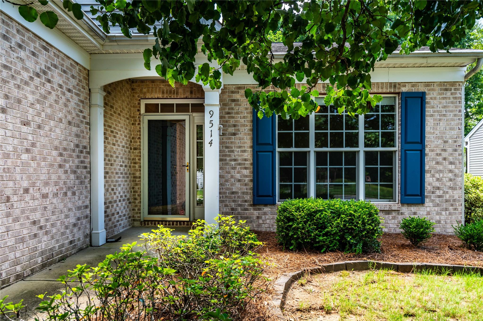 9514 Kestral Ridge Drive Charlotte, NC 28269 - Photo 3 of 32 a front view of a house with a yard