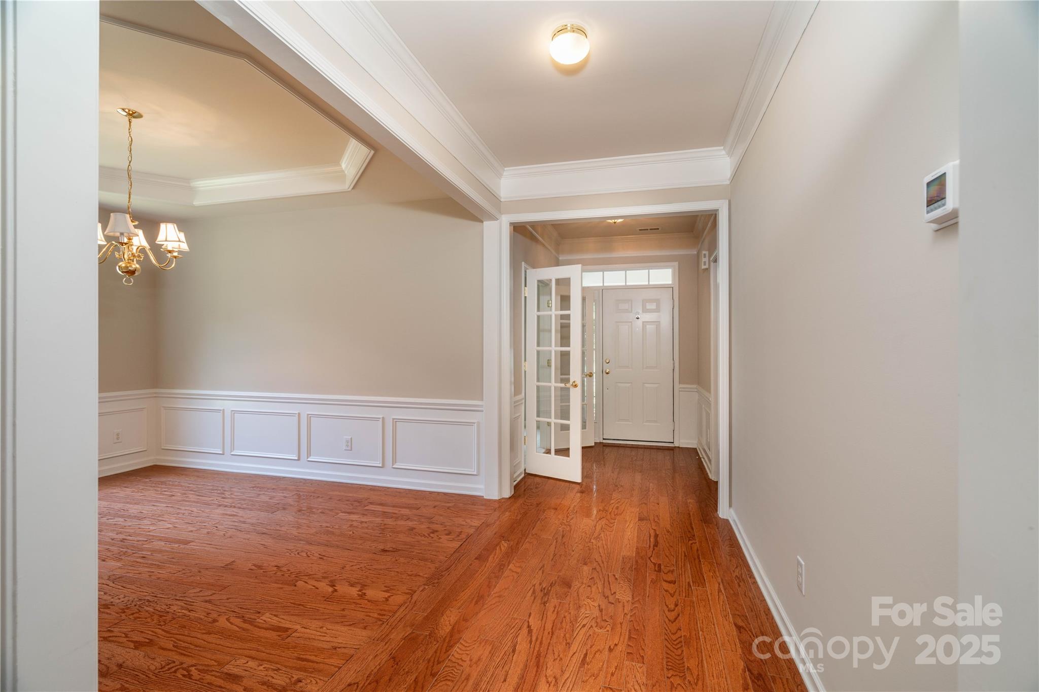 9514 Kestral Ridge Drive Charlotte, NC 28269 - Photo 7 of 32 a view of an empty room with wooden floor