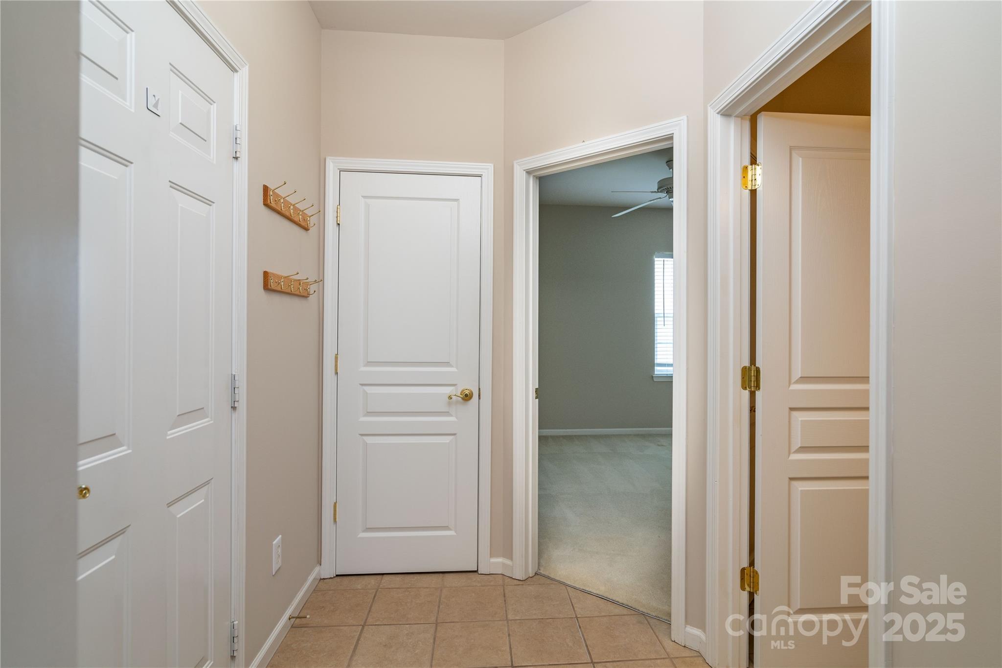 9514 Kestral Ridge Drive Charlotte, NC 28269 - Photo 8 of 32 a view of an empty room with closet and mirror
