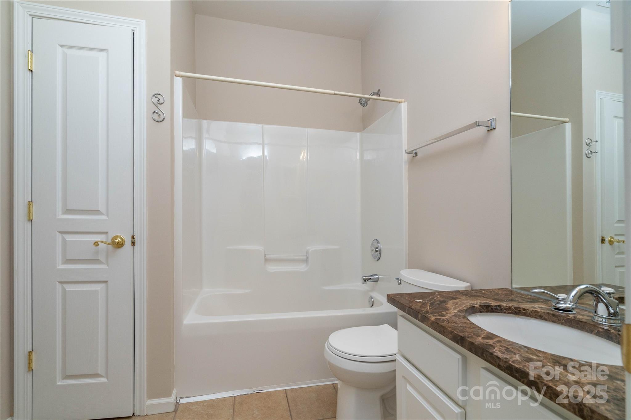 9514 Kestral Ridge Drive Charlotte, NC 28269 - Photo 10 of 32 a bathroom with a granite countertop sink toilet and shower