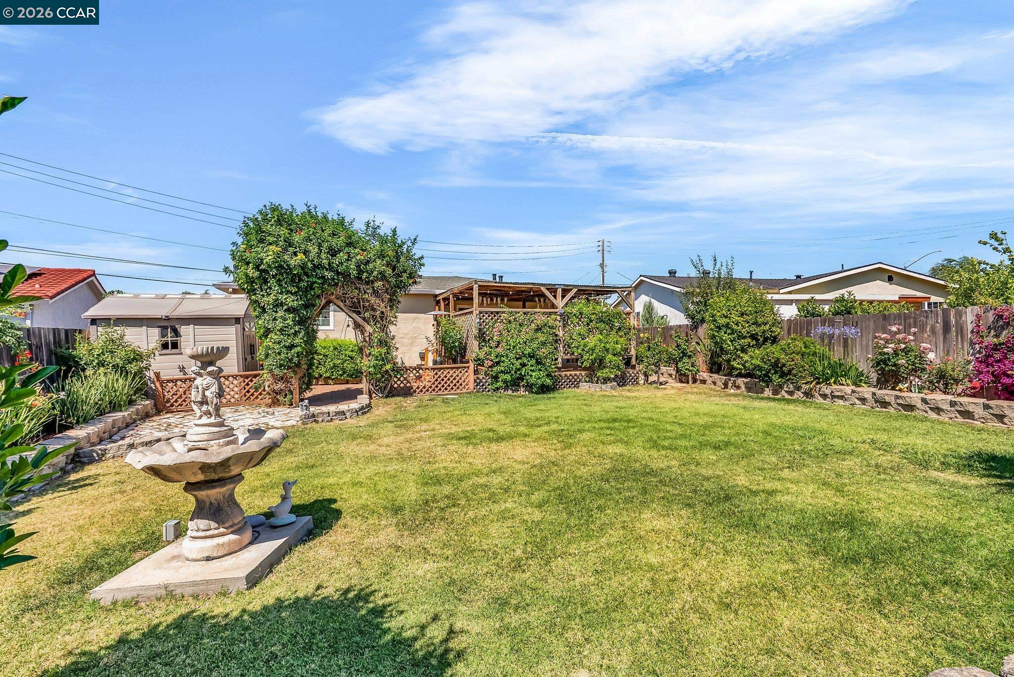 183 West Leland Road Pittsburg, CA 94565 - Photo 21 of 21 a view of a swimming pool with lawn chairs and plants