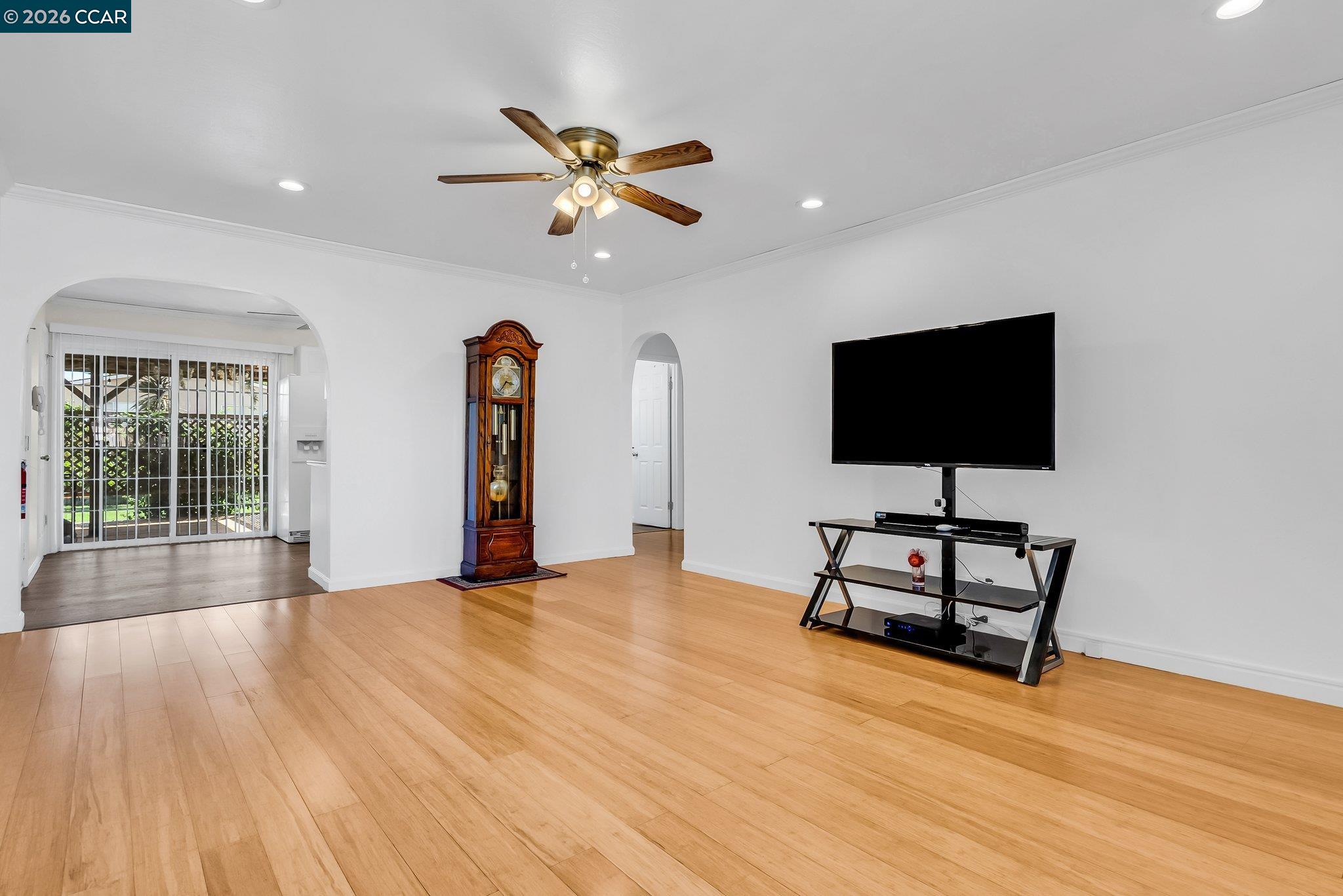 183 West Leland Road Pittsburg, CA 94565 - Photo 4 of 21 a view of empty room with wooden floor and fan