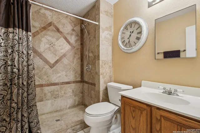 a bathroom with a toilet and a sink