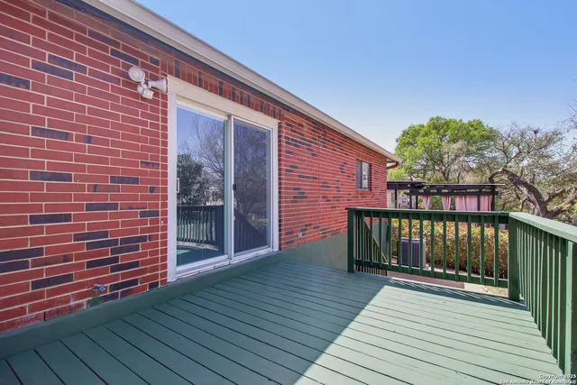 a view of a brick house with a balcony