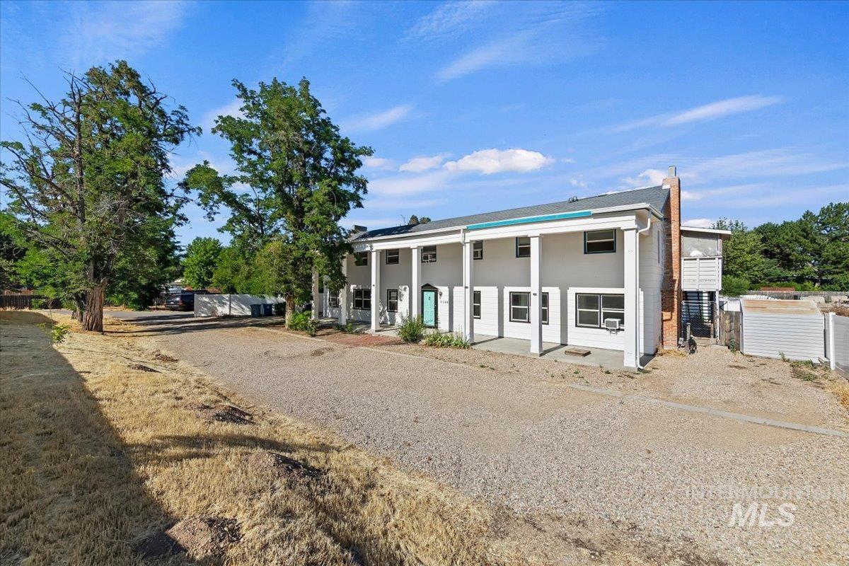 2160 South Five Mile Road Boise, ID 83709 - Photo 4 of 41 Two-story residence featuring a columned facade and multiple window units
