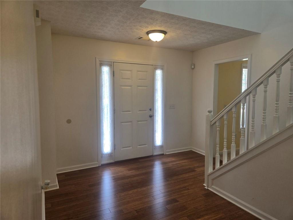 22 Windcrest Keep Covington, GA 30016 - Photo 4 of 32 a view of an entryway with wooden floor