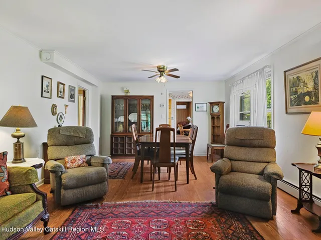 a bedroom with two beds and a window