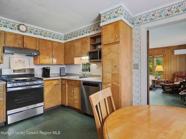 a bedroom with a bed and a dresser in it