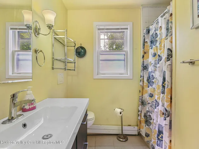 a picture of a bench in front of a wall