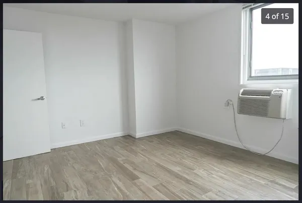 a view of an empty room with a window