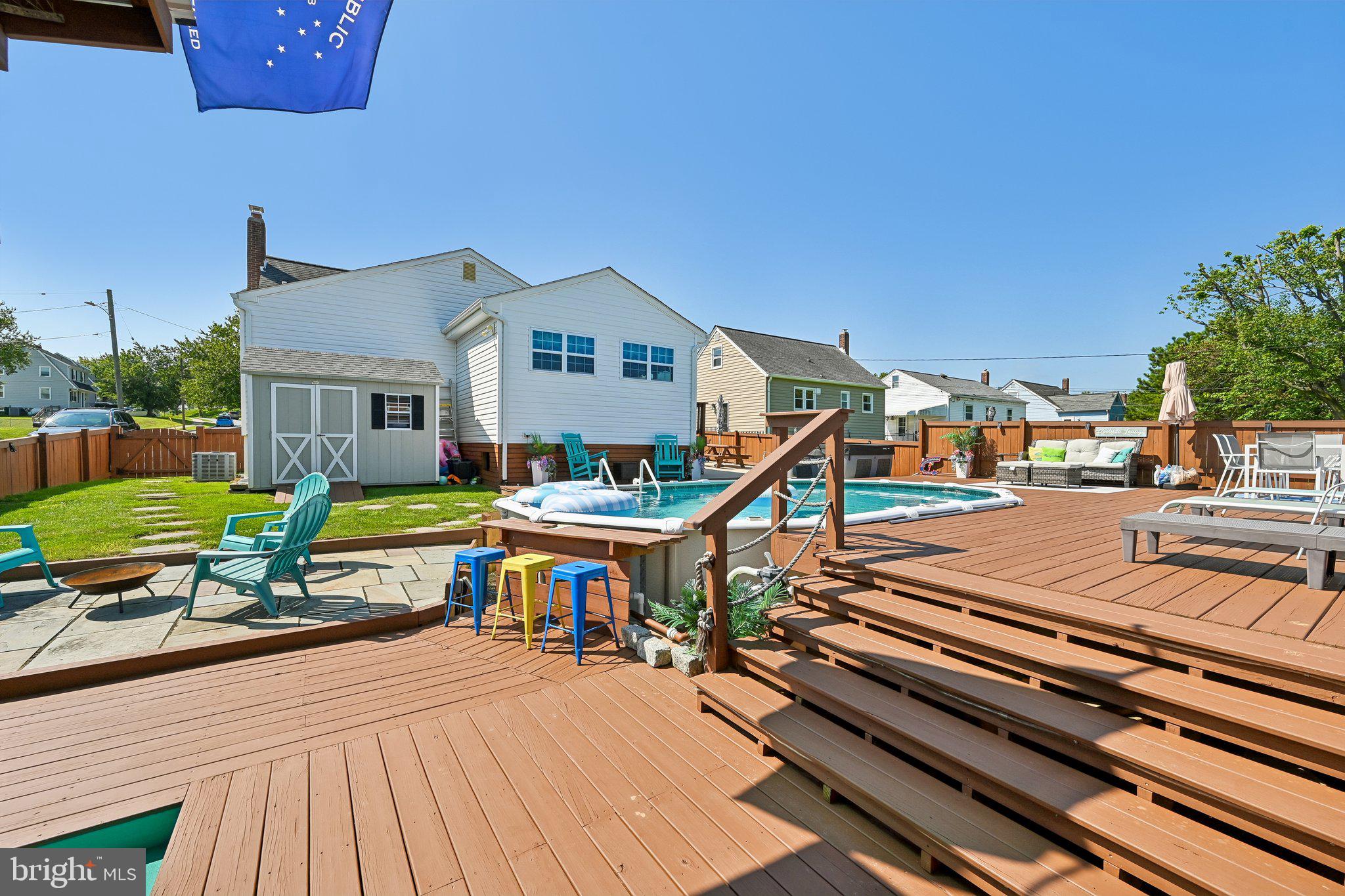 1248 June Road Baltimore, MD 21227 - Photo 52 of 80 Sunny backyard oasis with poolside charm.