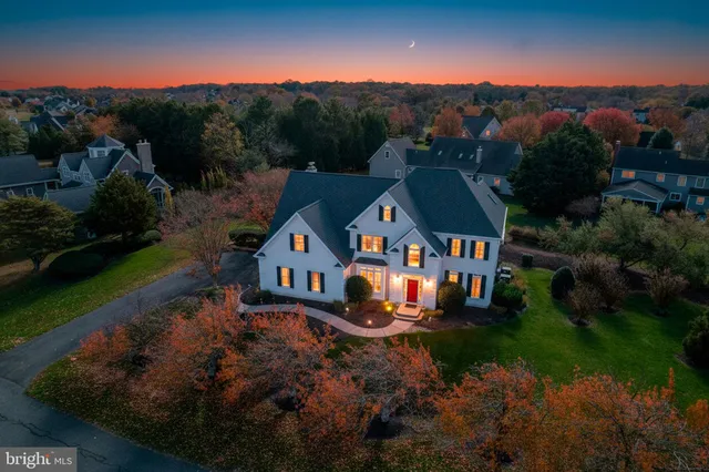 an aerial view of a house with a big yard