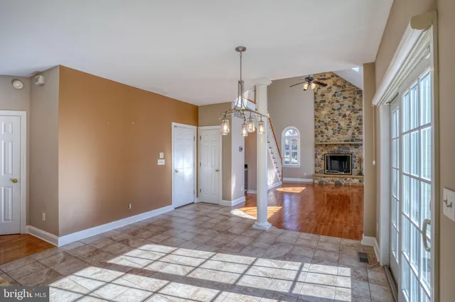 a bathroom with a toilet a sink a mirror and a shower