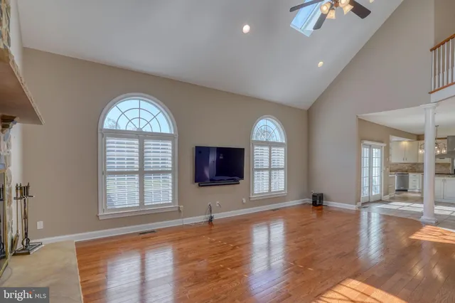 a bathroom with a granite countertop sink a toilet and a bathtub