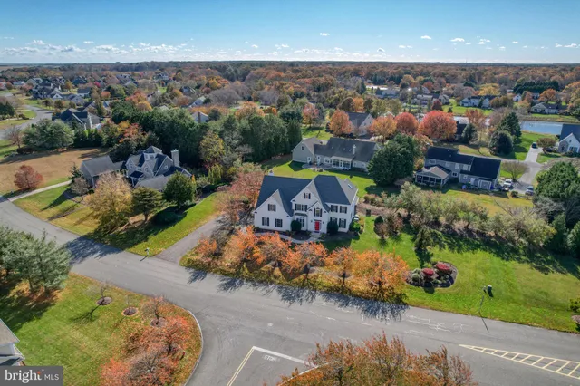 an aerial view of a house with a swimming pool yard and outdoor seating