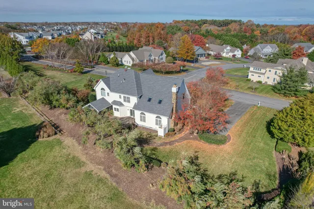 an aerial view of a house with a lake view