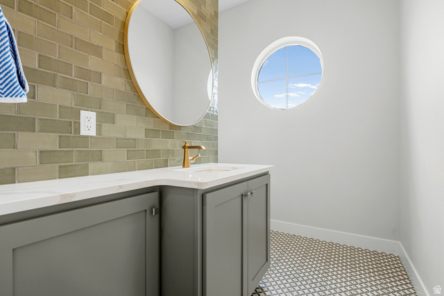 250 South Main Street, Unit 24 Alpine, UT 84004 - Photo 37 of 50 Bathroom featuring decorative backsplash and double vanity