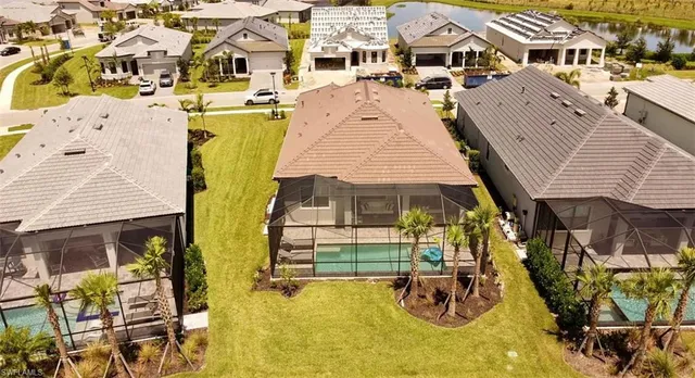 an aerial view of a house with swimming pool