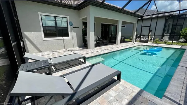 a patio with a table and chairs