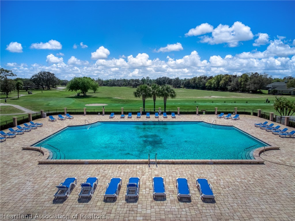4734 Haw Branch Road, Unit 110 Sebring, FL 33875 - Photo 42 of 50 a view of a swimming pool and outdoor seating