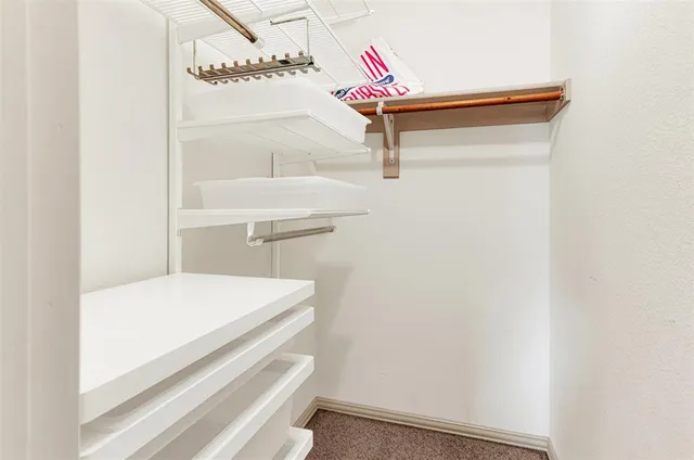 a bathroom with a bathtub and a window