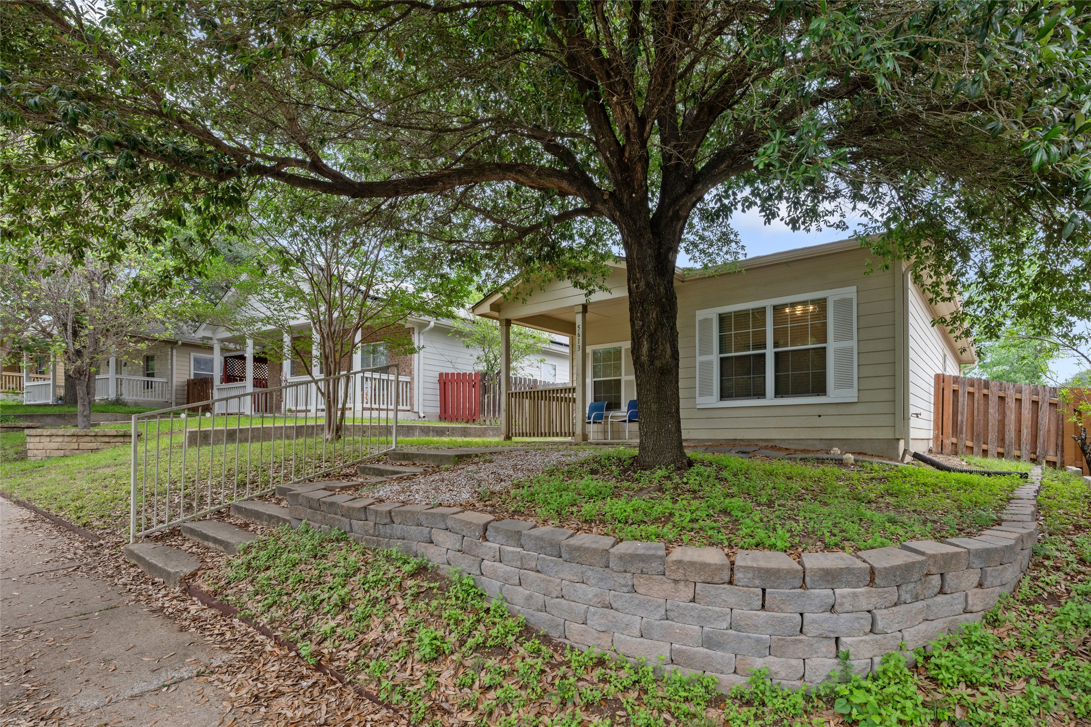 5613 Signal Point Austin, TX 78724 - Photo 3 of 21 Light beige siding exterior with white window shutters