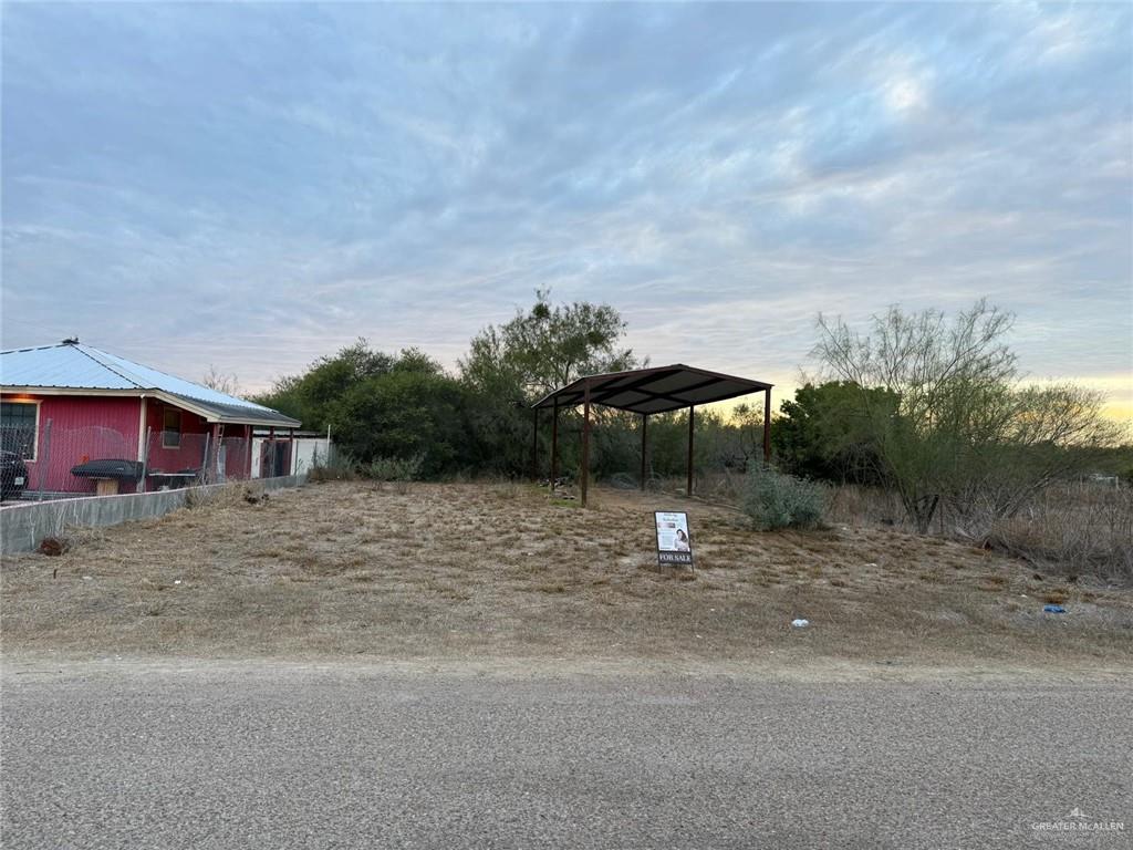 0 East Sendero Road East Sullivan City, TX 78595 - Photo 4 of 6 a backyard of a house with table and chairs