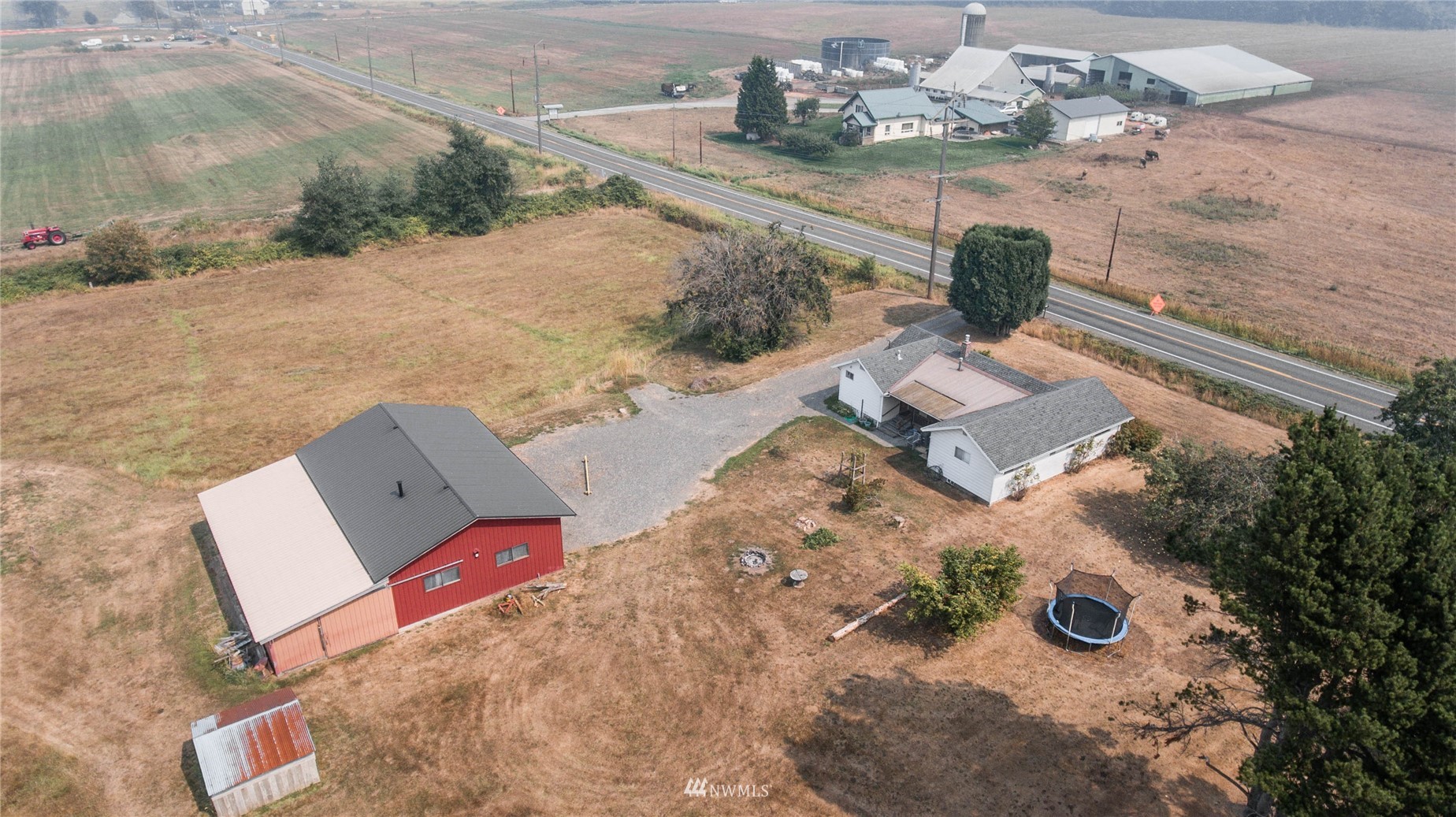 6783 Kickerville Road Ferndale, WA 98248 - Photo 1 of 22 an aerial view of a house with outdoor space