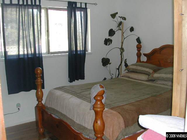 3340 Heights Reno, NV 89503 - Photo 6 of 9 a bedroom with a bed and a window