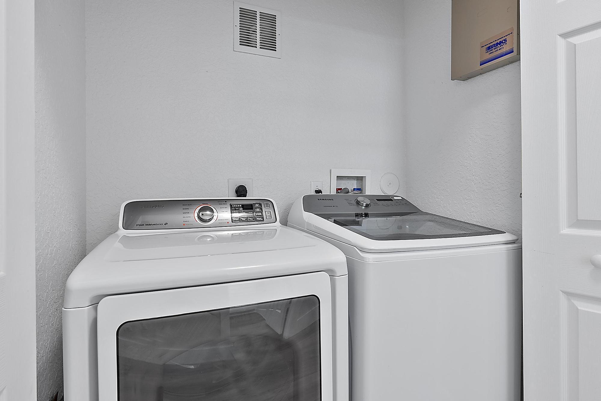 107 Pond Apple Lane, Unit 105 Jupiter, FL 33458 - Photo 24 of 37 a utility room with dryer and washer