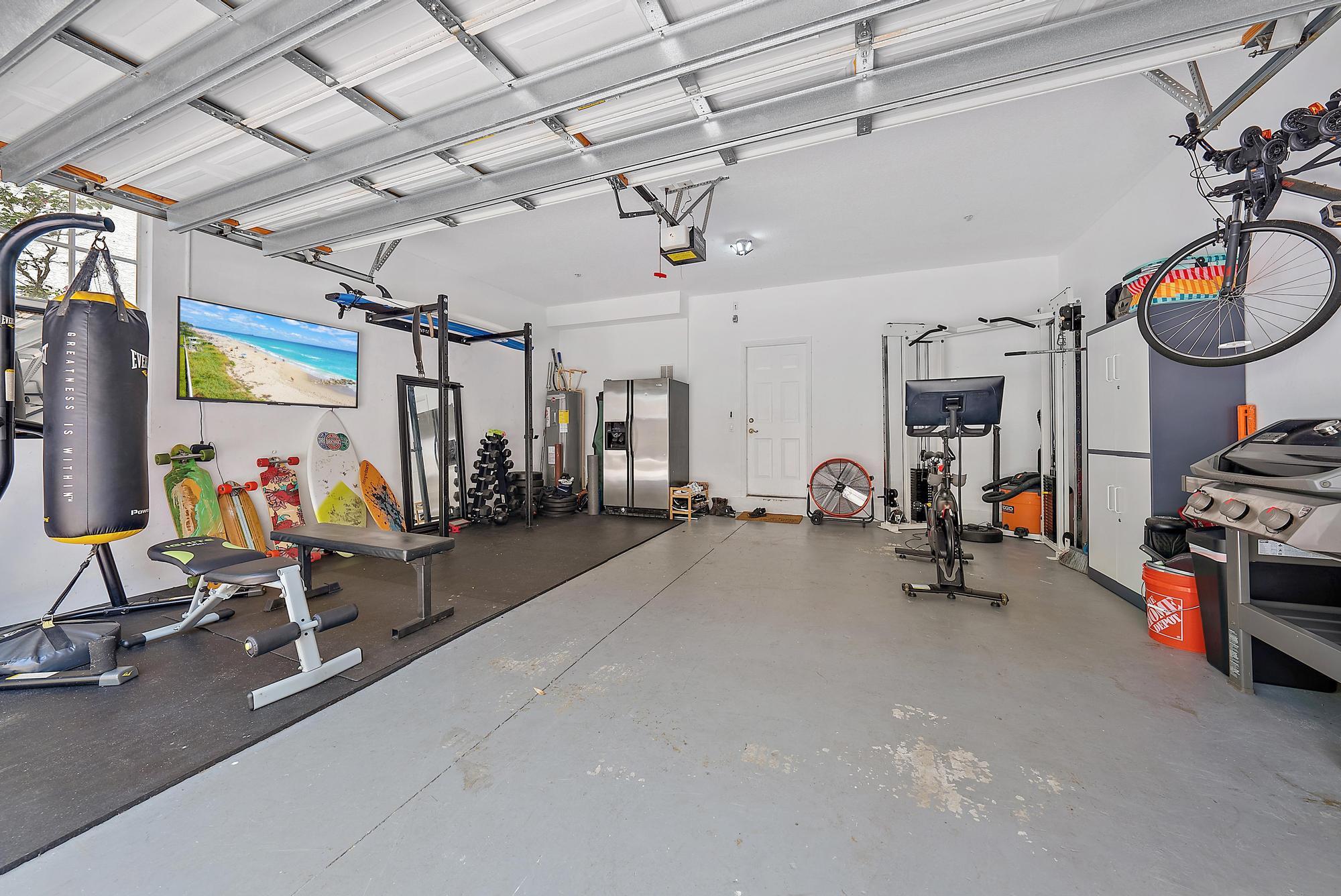 107 Pond Apple Lane, Unit 105 Jupiter, FL 33458 - Photo 25 of 37 a view of a room with gym equipment