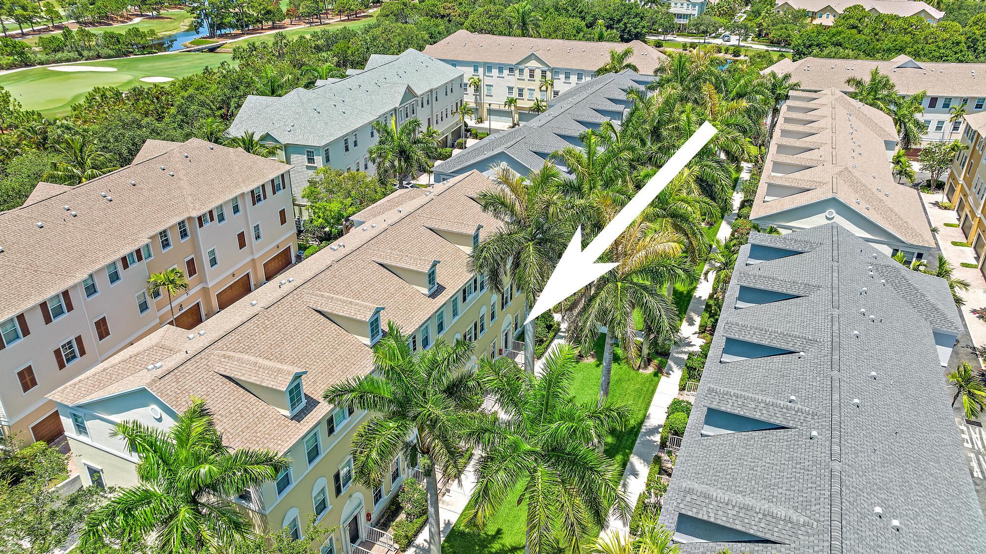 107 Pond Apple Lane, Unit 105 Jupiter, FL 33458 - Photo 28 of 37 an aerial view of a house with outdoor space and street view