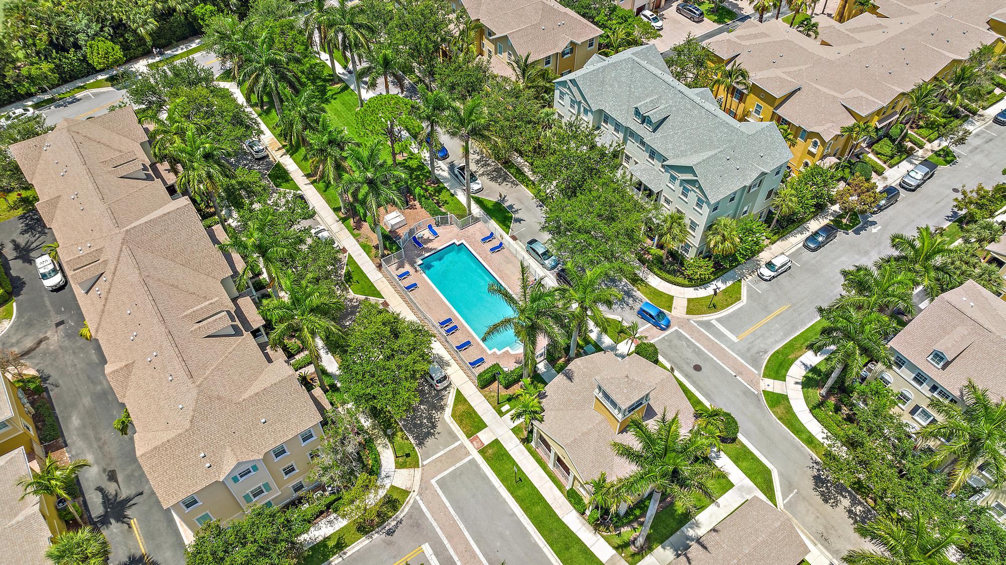107 Pond Apple Lane, Unit 105 Jupiter, FL 33458 - Photo 29 of 37 an aerial view of a house with a yard and garden