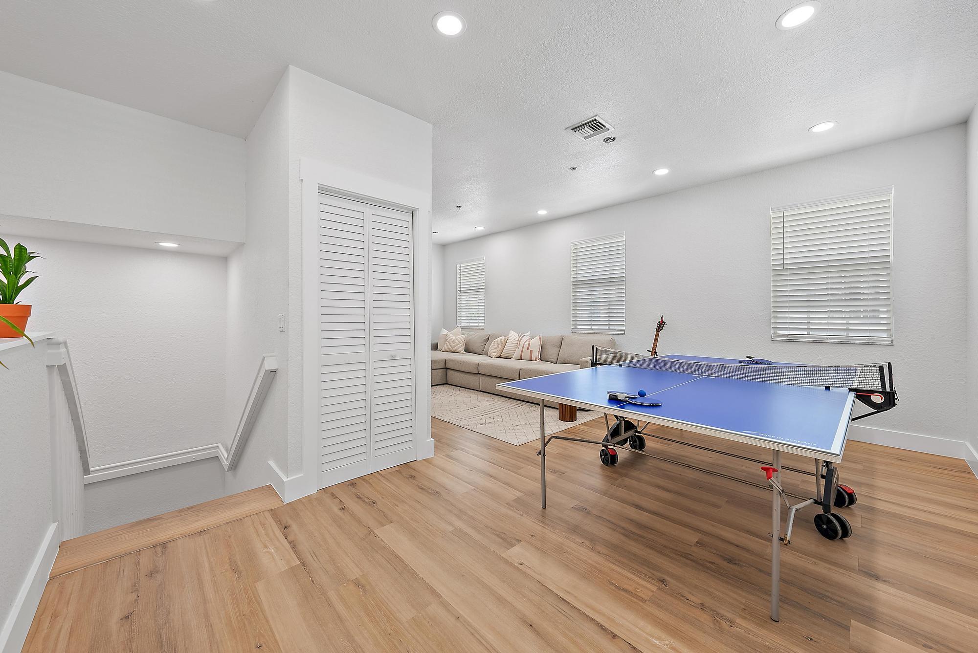 107 Pond Apple Lane, Unit 105 Jupiter, FL 33458 - Photo 8 of 37 a living room with furniture and a wooden floor