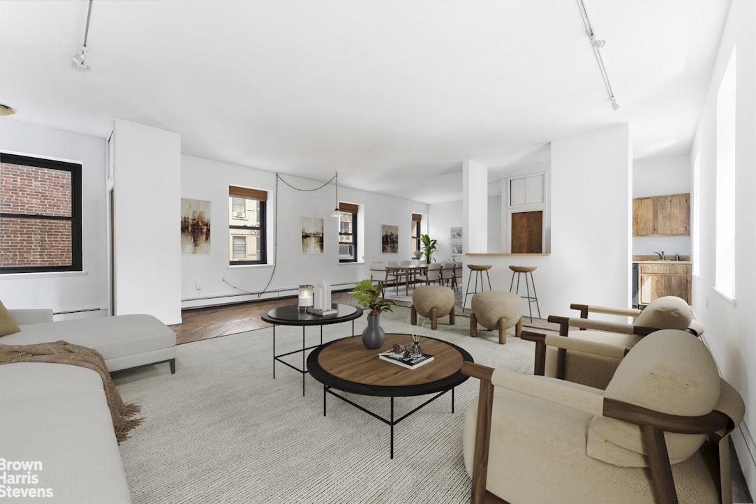454 West 46th Street, Unit 4CS Manhattan, NY 10036 - Photo 1 of 18 a living room with furniture potted plant and wooden floor