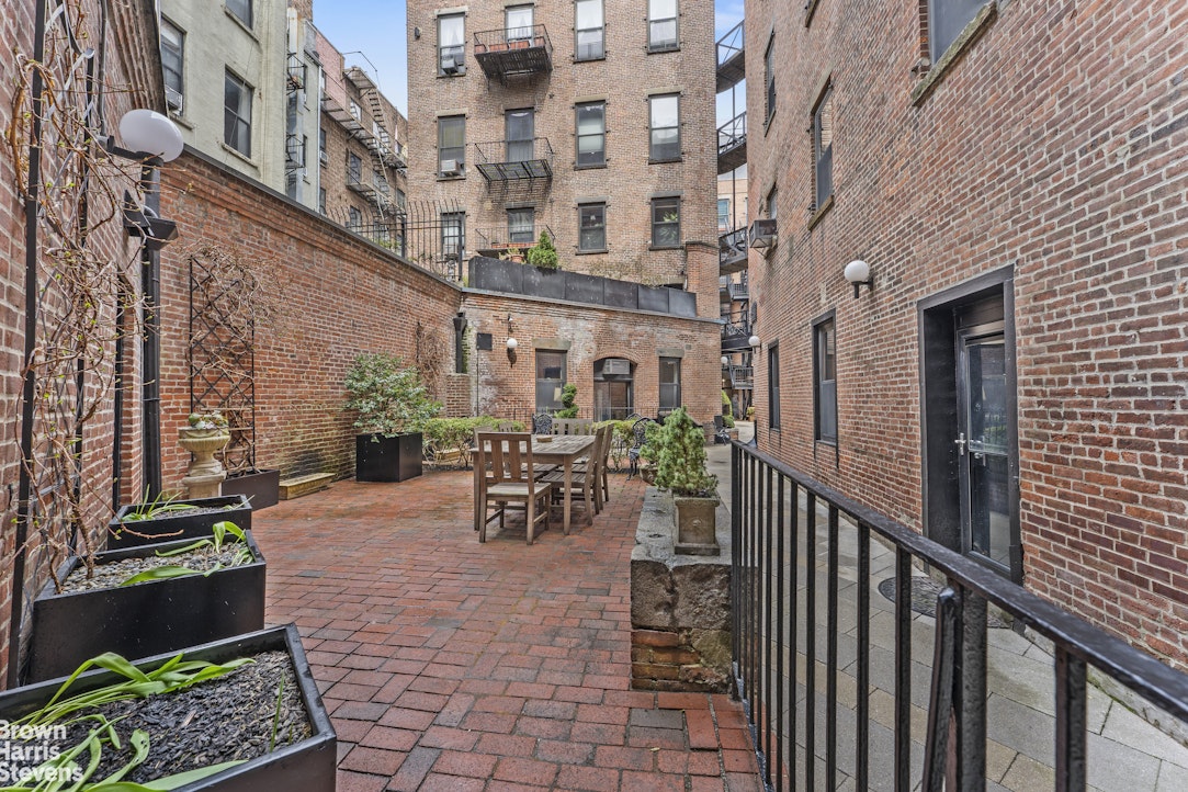 454 West 46th Street, Unit 4CS Manhattan, NY 10036 - Photo 16 of 18 a view of a building with sitting area