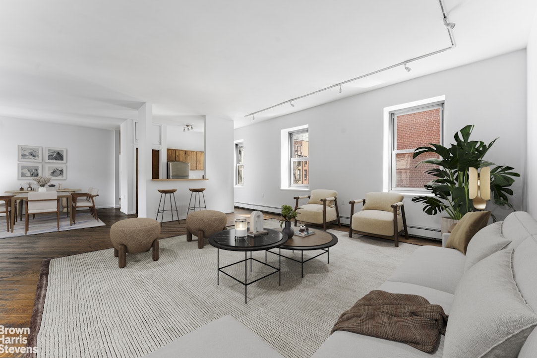 454 West 46th Street, Unit 4CS Manhattan, NY 10036 - Photo 3 of 18 a living room with furniture or couch and a potted plant