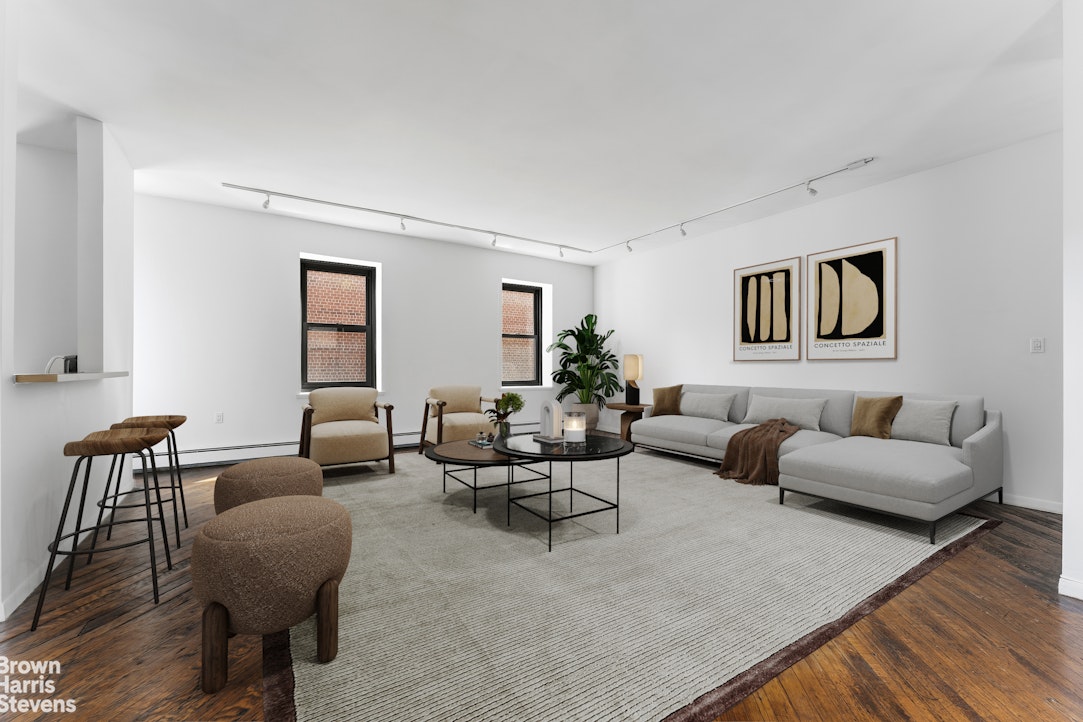 454 West 46th Street, Unit 4CS Manhattan, NY 10036 - Photo 7 of 18 a living room with furniture and a wooden floor