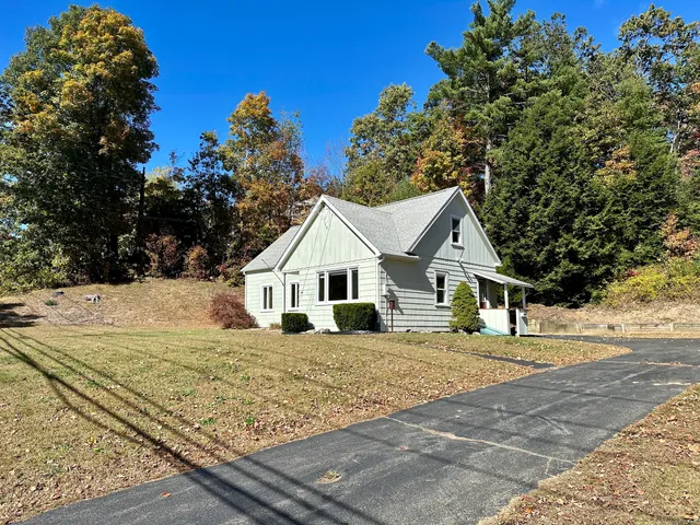 a house with trees in the background