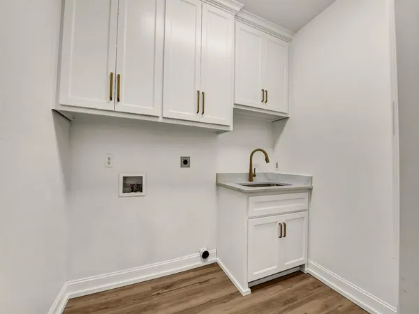 a view of cabinets and wooden floor