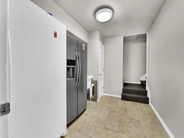 a view of a hallway with closet and a couch