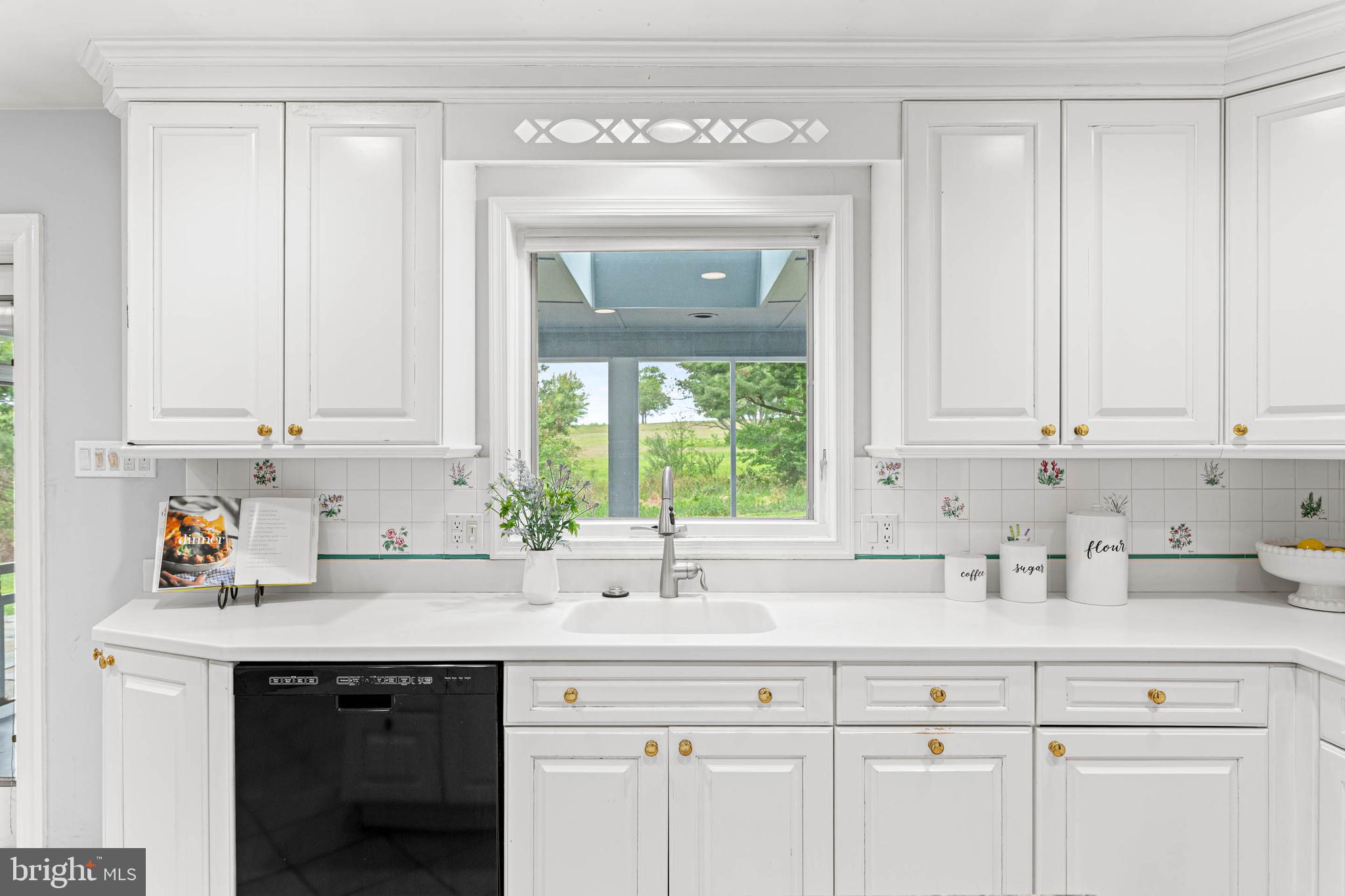 533 Gulph Road Wayne, PA 19087 - Photo 10 of 43 a kitchen with stainless steel appliances granite countertop white cabinets a sink and a window