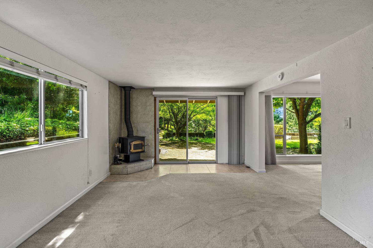 625-629 Hill Road Angwin, CA 94508 - Photo 14 of 64 a view of an empty room with wooden floor and a window