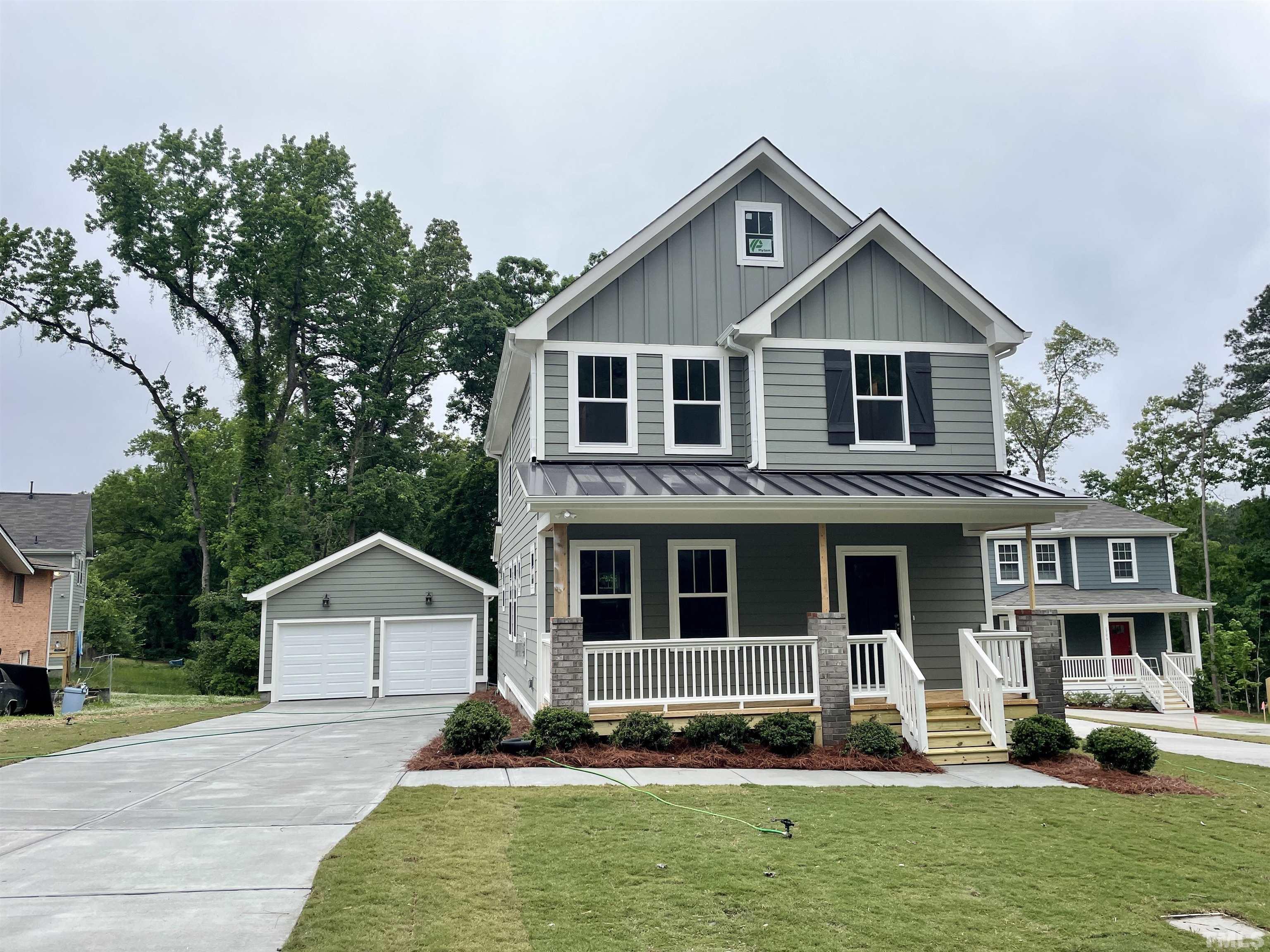1308 B Castlebay Road Durham, NC 27704 - Photo 1 of 25 a front view of a house with a yard