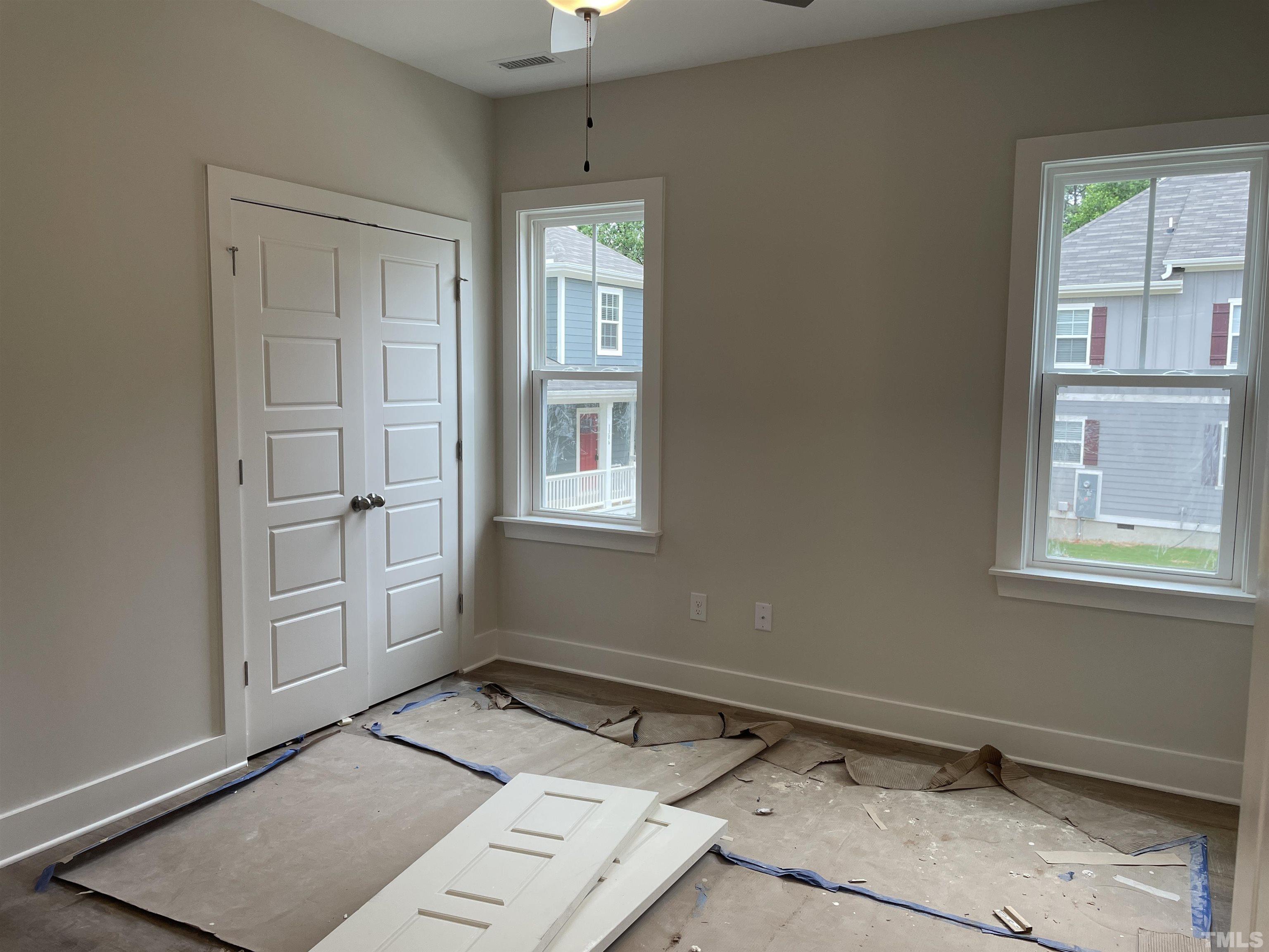 1308 B Castlebay Road Durham, NC 27704 - Photo 12 of 25 an empty room with windows